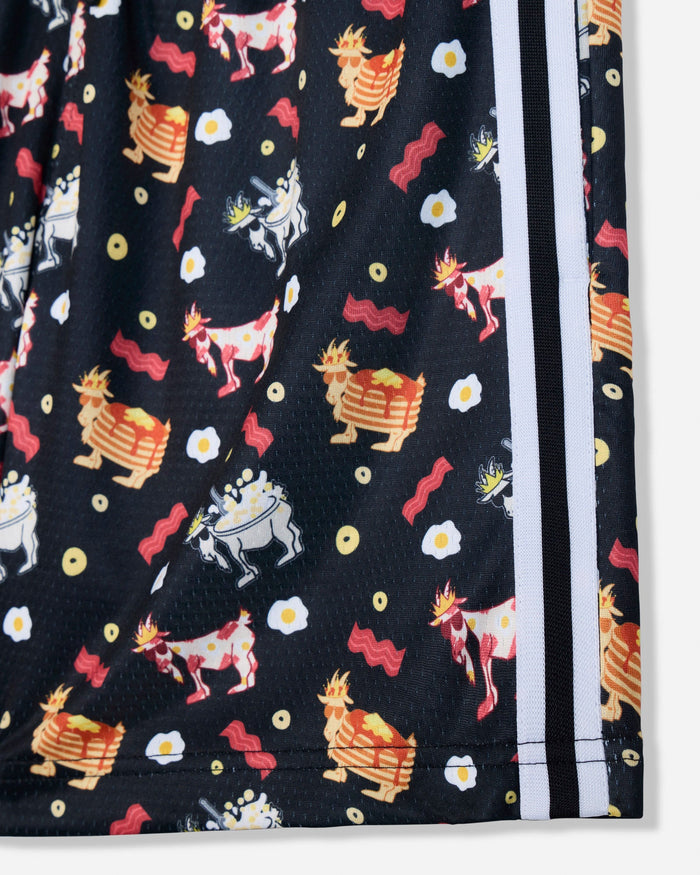 Close-up of a black athletic shorts leg featuring a colorful cartoon print of goats, eggs, and bacon, with white side stripes.