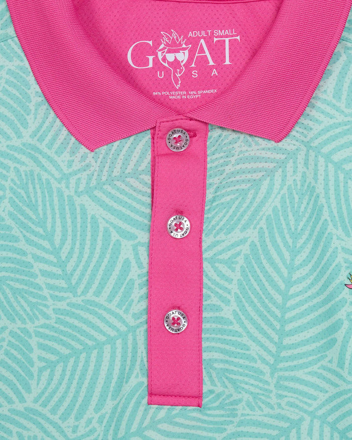 Close-up of a pink and green patterned polo shirt with 'GOAT USA' branding.