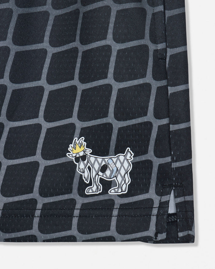 Close-up of hockey goat on black mesh shorts with a hockey net pattern