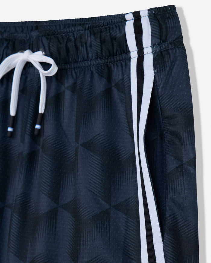 Close-up of dark athletic shorts with a subtle geometric pattern, featuring a white drawstring and two vertical white stripes along the side.#color_black