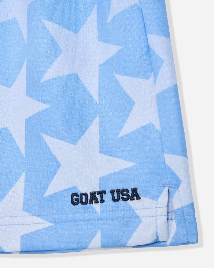 Close-up of carolina blue mesh shorts with a star pattern with stitched 'GOAT USA' text#color_carolina-blue