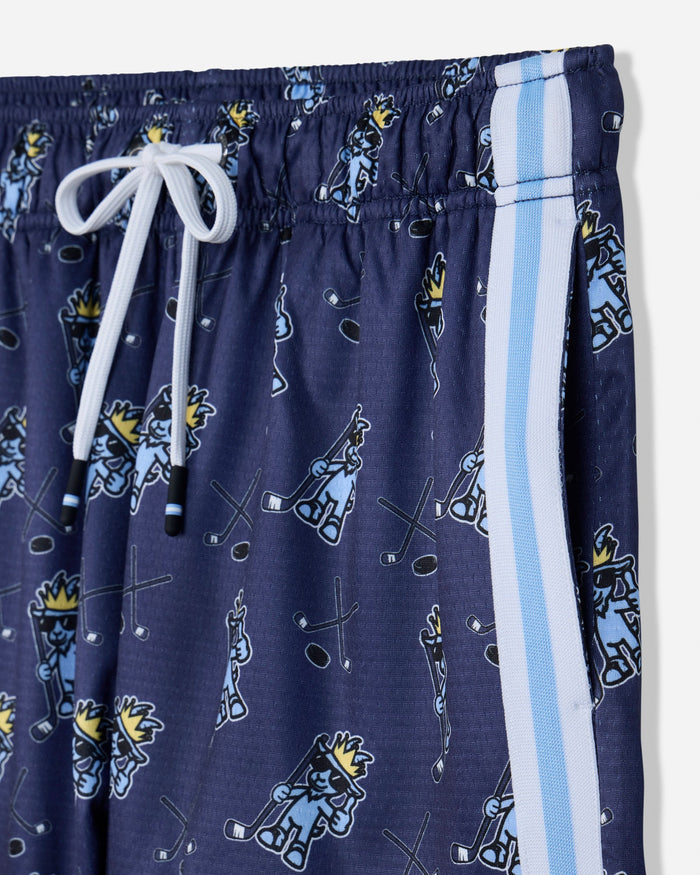 Close-up of pocket of navy mesh shorts with blue goat and hockey design
