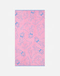 Pink towel with blue goat pattern on a white background