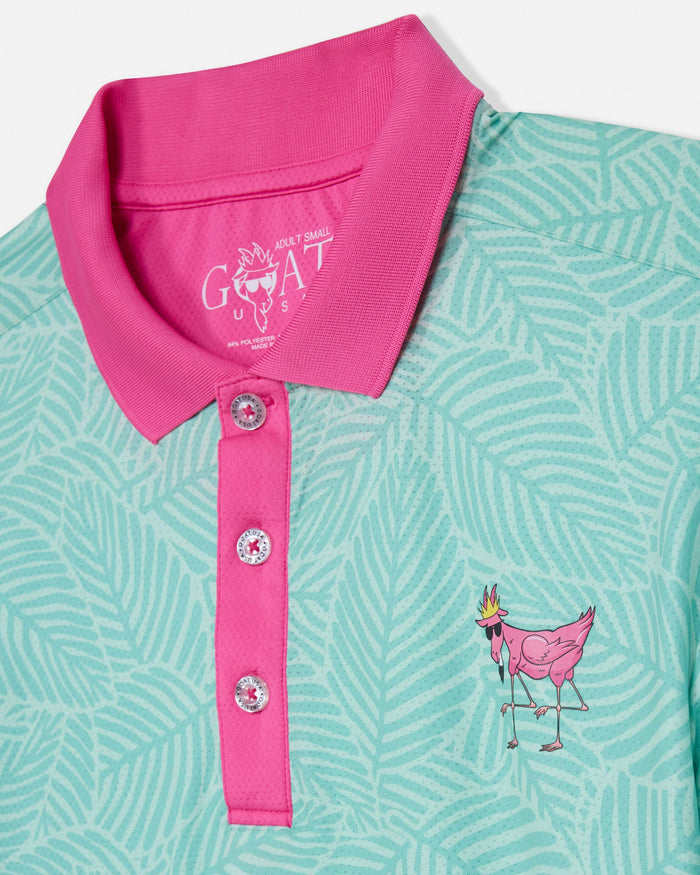 Mint green polo shirt with pink collar and goat graphic on a white background