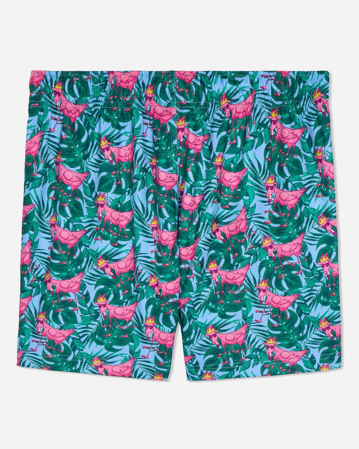 Tropical patterned shorts with pink flamingo goats on a white background