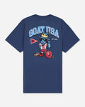 A navy blue short-sleeve t-shirt with a large graphic on the back. The graphic features the text 'GOAT USA' in light blue, a cartoon goat mascot wearing a gold crown and sunglasses, a red football helmet, and a red and white pennant.