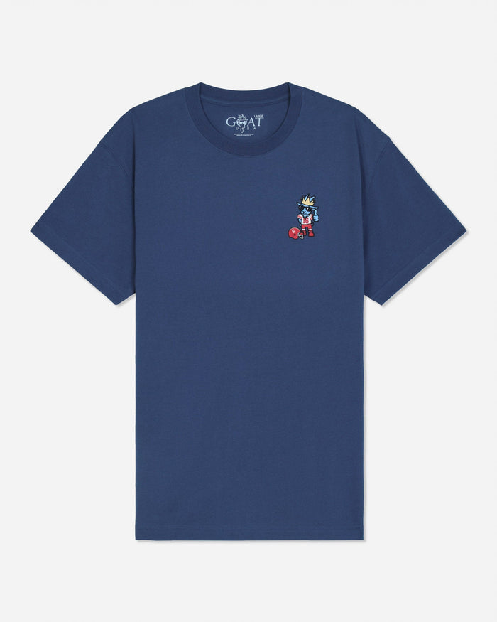 A navy blue short-sleeve t-shirt with a small embroidered cartoon character on the left chest, displayed flat against a light gray background. The inner neck label shows the brand 'GOAT'.