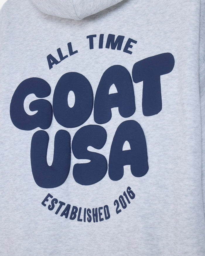 Close-up of back of gray hoodie with 'ALL TIME GOAT USA ESTABLISHED 2016' text#color_pale-gray
