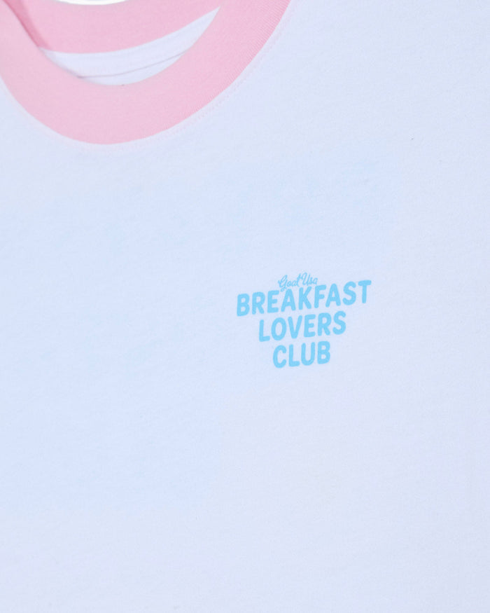 Left chest graphic that reads 'GOAT USA BREAKFAST LOVERS CLUB' on a white oversized t-shirt