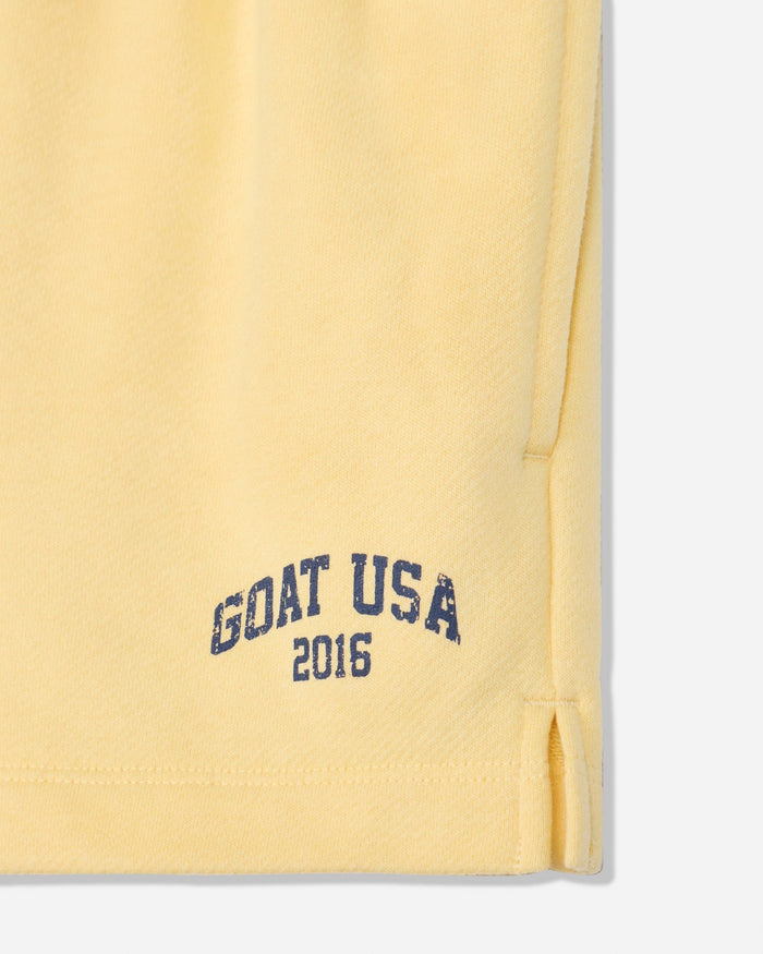 Close-up of corn milk sweat shorts with 'GOAT USA 2016' text#color_corn-milk