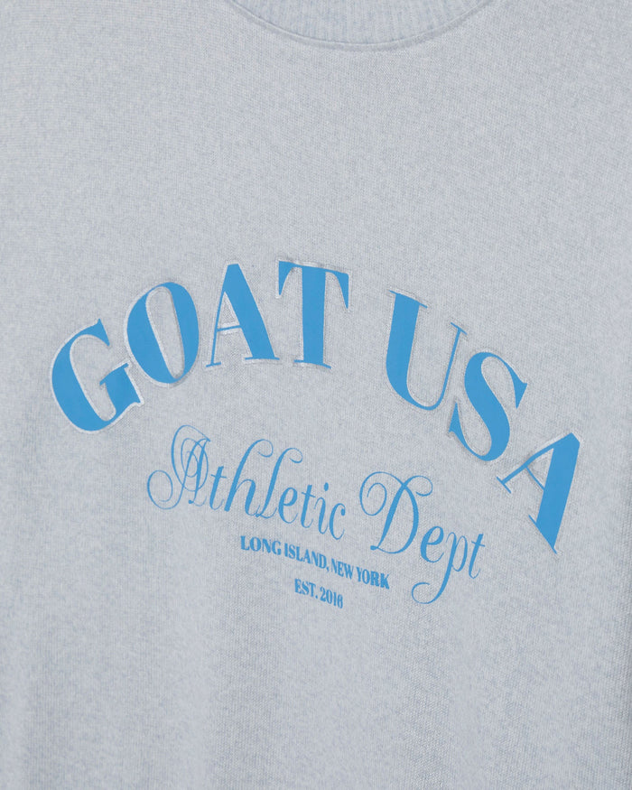 Gray sweatshirt with blue 'GOAT USA Athletic Dept' text on a gray background