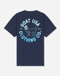 A navy blue short-sleeve t-shirt shown from the back, featuring a large light blue graphic print with a goat illustration and the text 'GOAT USA CLOTHING CO.' and 'EST.#color_navy-blazer