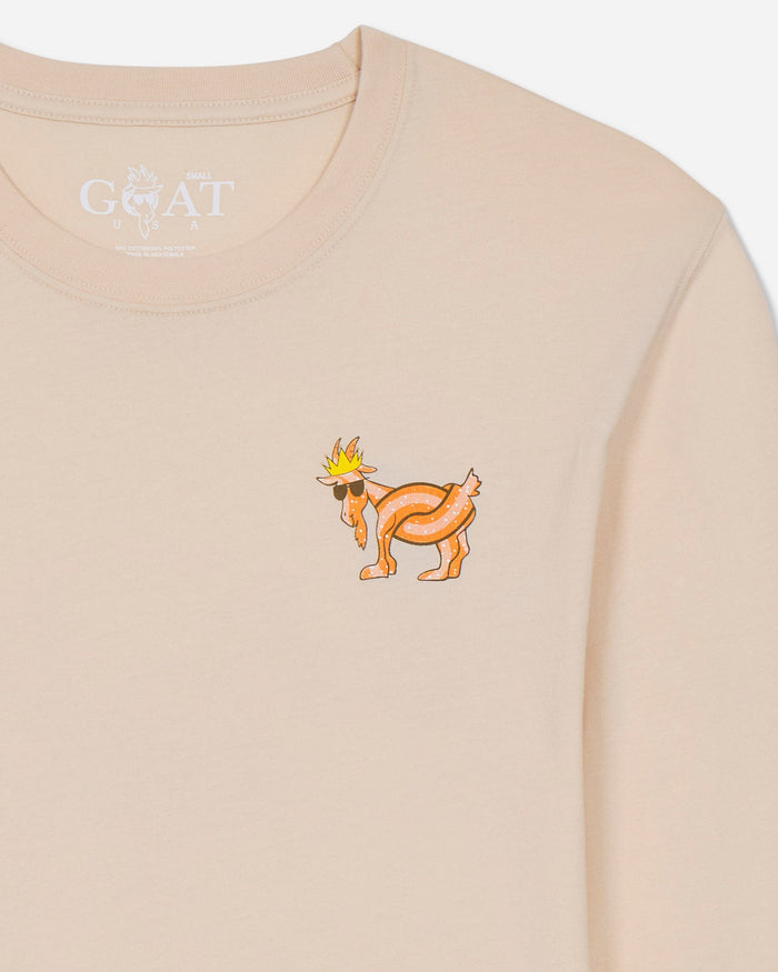 Beige t-shirt with a cartoon goat on a light gray background