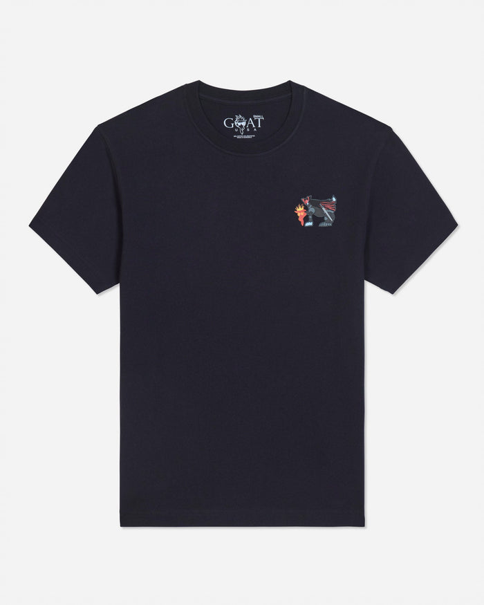 A black blue short-sleeve t-shirt with a small multicolor graphic on the left chest and a visible 'GOAT' brand print inside the collar, shown against a light gray background.