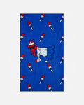 Beach towel with a goat that has a popsicle pattern on a light gray background