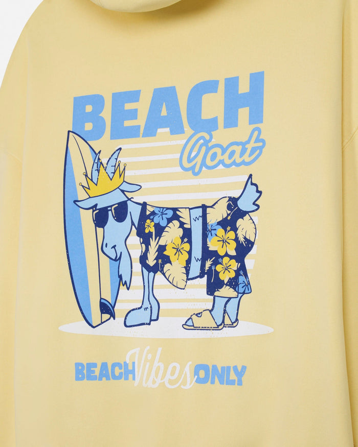 Yellow sweatshirt with 'Beach Goat' graphic design featuring a goat with a surfboard and tropical attire.