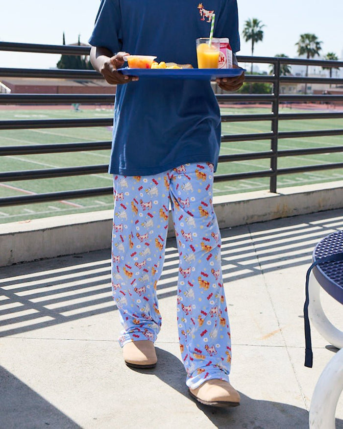 Front of carolina blue pajama pants on a male model with breakfast designs