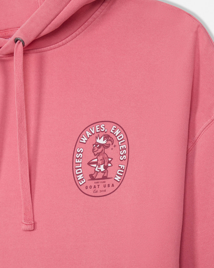 Salmon-colored hoodie with a graphic design on the chest