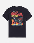 A black short-sleeve t-shirt shown from the back, featuring a large graphic print of Batman with flames and the text 'THE HEADLESS GOATMAN' and 'GREATNESS DOESN'T NEED A HEAD'.