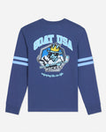 A royal blue long-sleeve t-shirt with a large graphic on the back featuring a cartoon goat hockey player and the text 'GOAT USA HOCKEY'. The sleeves have two light blue stripes, and the shirt is shown against a light gray background.