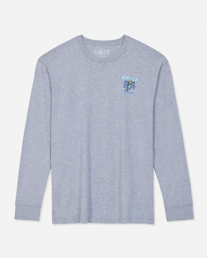 A light heather gray long-sleeve t-shirt with a small light blue and white 'GOAT USA' graphic on the left chest, displayed flat against a light gray background.