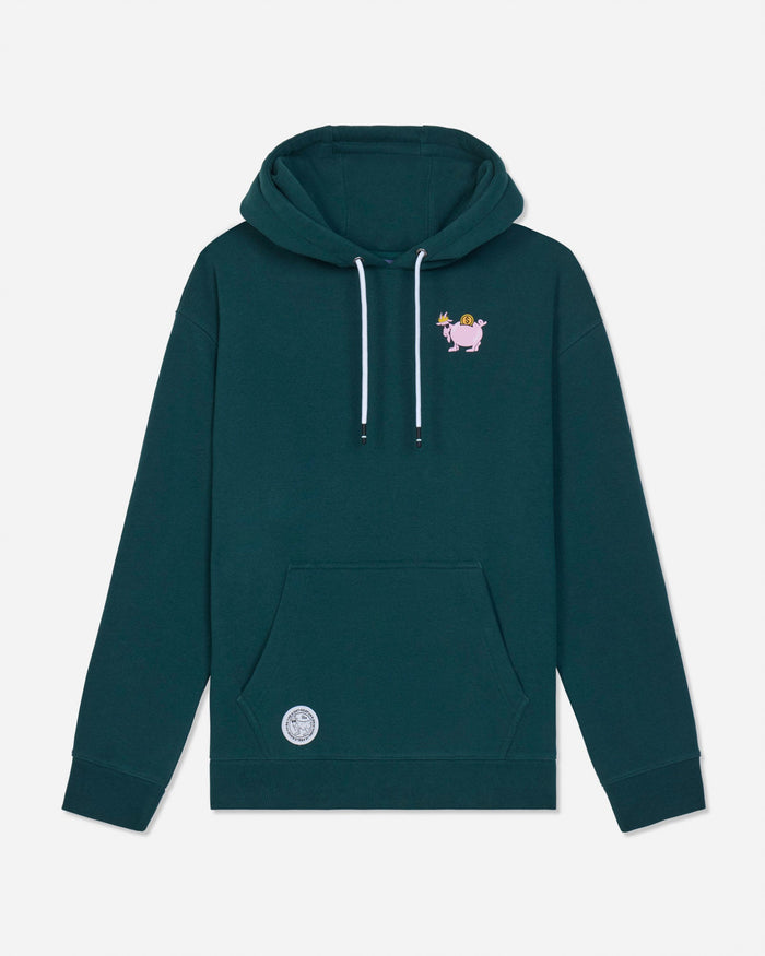A dark teal green pullover hoodie with white drawstrings, a small cartoon graphic on the left chest, and a circular patch near the bottom pocket, shown against a light gray background.