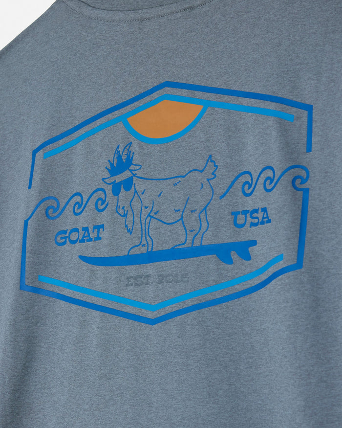 Gray t-shirt with a graphic of a goat on a surfboard and 'GOAT USA' text.#color_gray