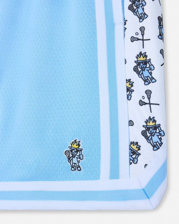 Close-up of a blue shorts with a patterned border featuring cartoon characters.