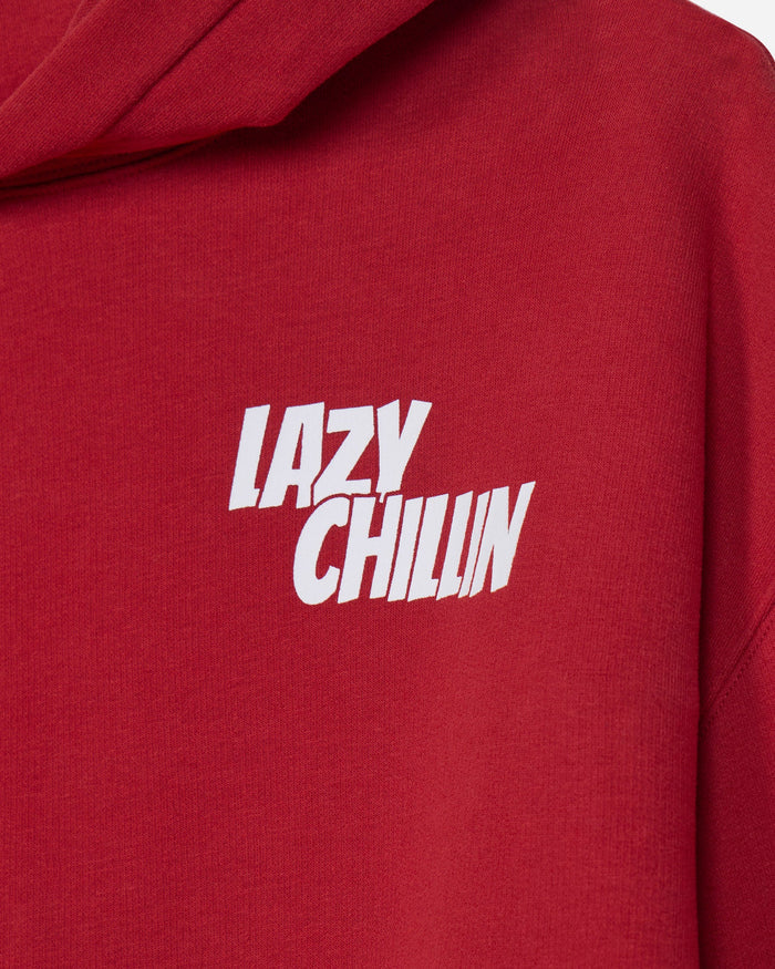 A close-up of a red hooded sweatshirt featuring the words 'LAZY CHILLIN' printed in bold white letters across the chest.