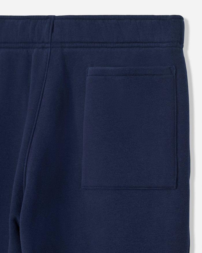 Close-up of navy blue sweatpants showing the waistband and a side pocket.#color_navy-blazer