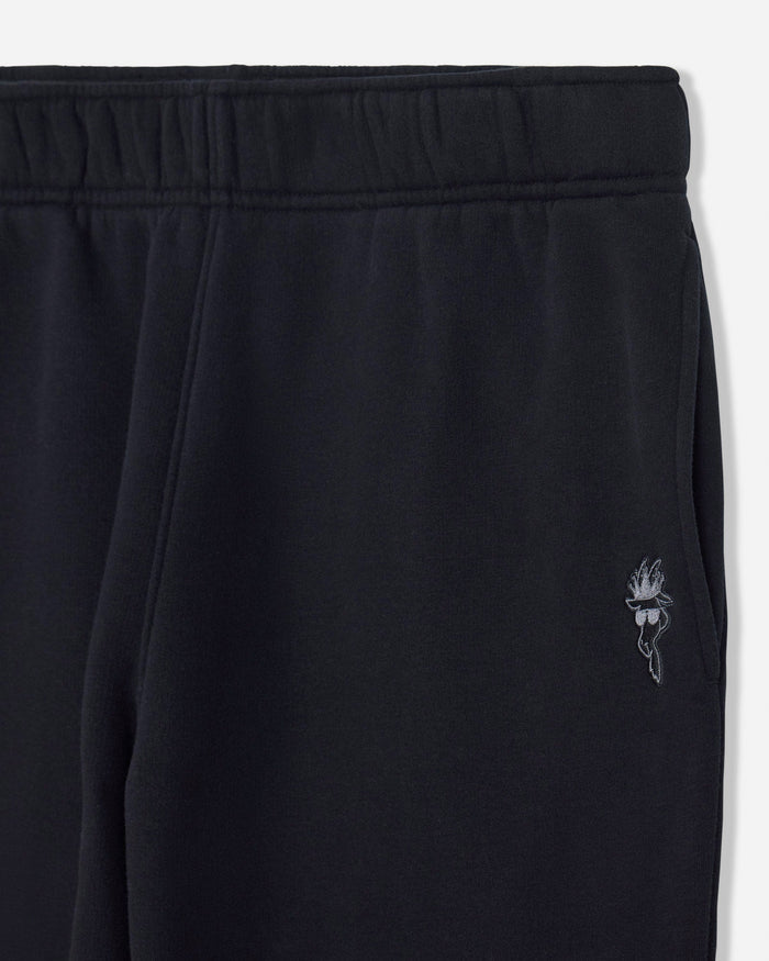 Black sweatpants with a brand logo on a white background#color_black
