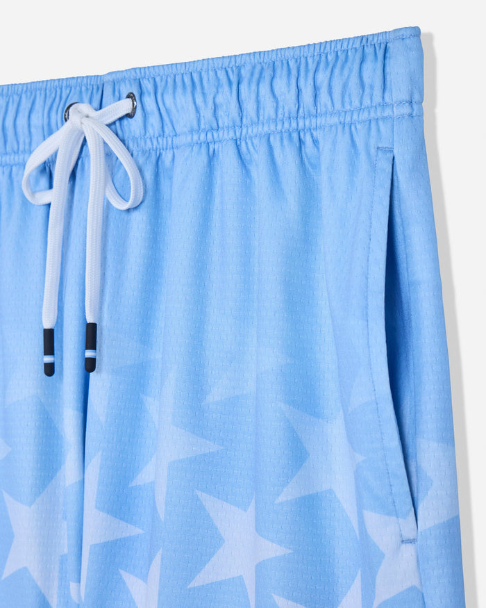 Close-up of pocket of carolina blue mesh shorts with a star pattern#color_carolina-blue