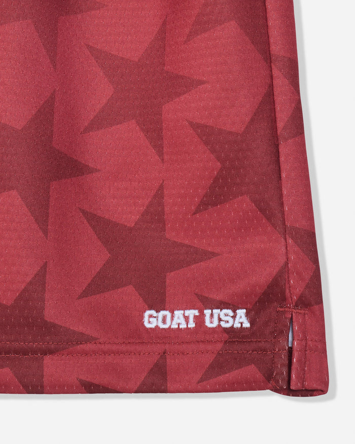Front of red mesh shorts with a star pattern and stitched 'GOAT USA' text#color_tomato