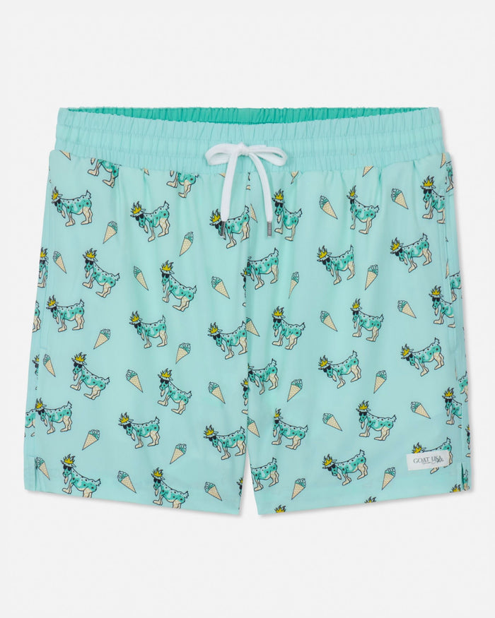 Mint swim shorts with goat and ice cream pattern on a white background