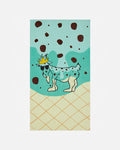 Illustration of a goat with a crown on a mint background with chocolate chips