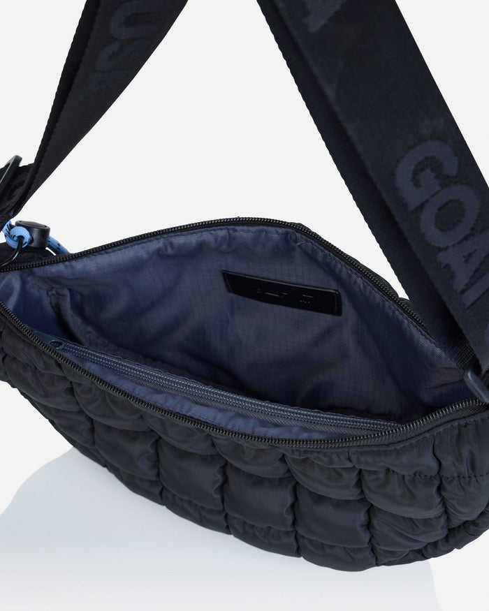 Inside pouch of black sling bag