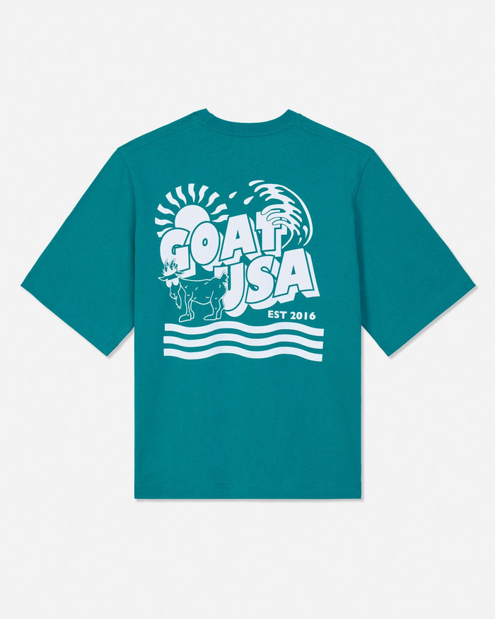 Teal t-shirt with white graphic design on a white background