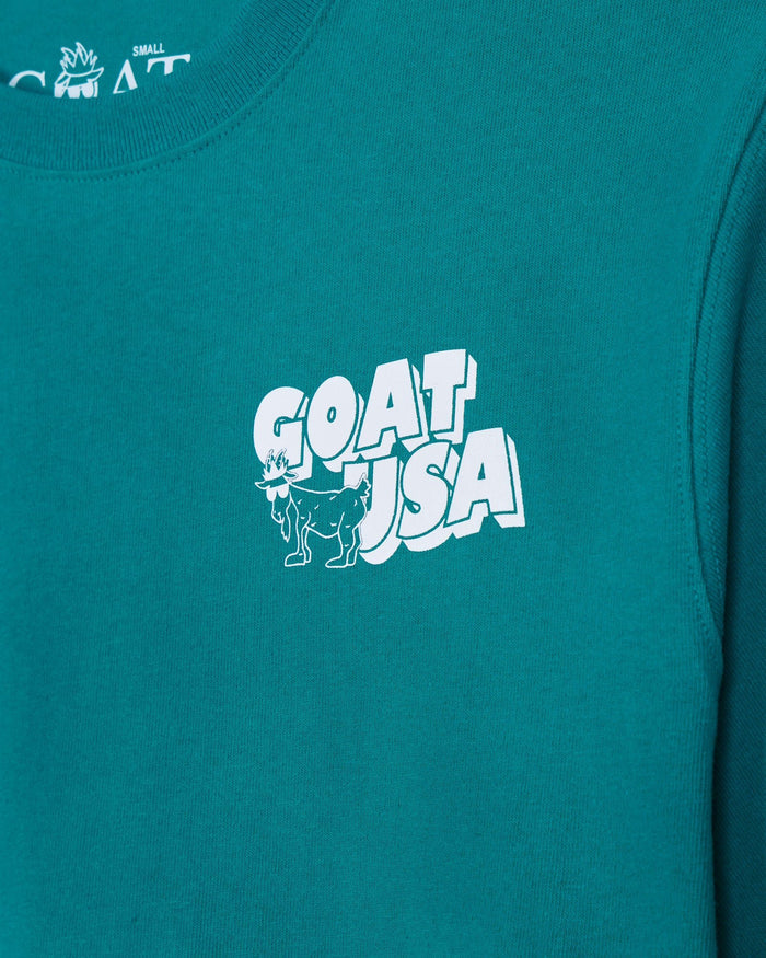 Teal garment with 'GOAT USA' graphic in white on a plain background