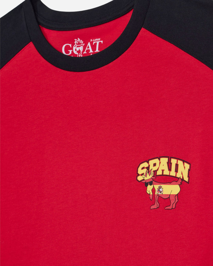 Red shirt with black collar featuring a 'Spain' logo and goat emblem.