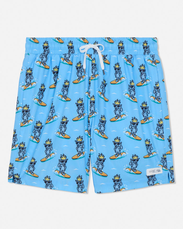 Blue swim shorts with cartoon character pattern on a light gray background