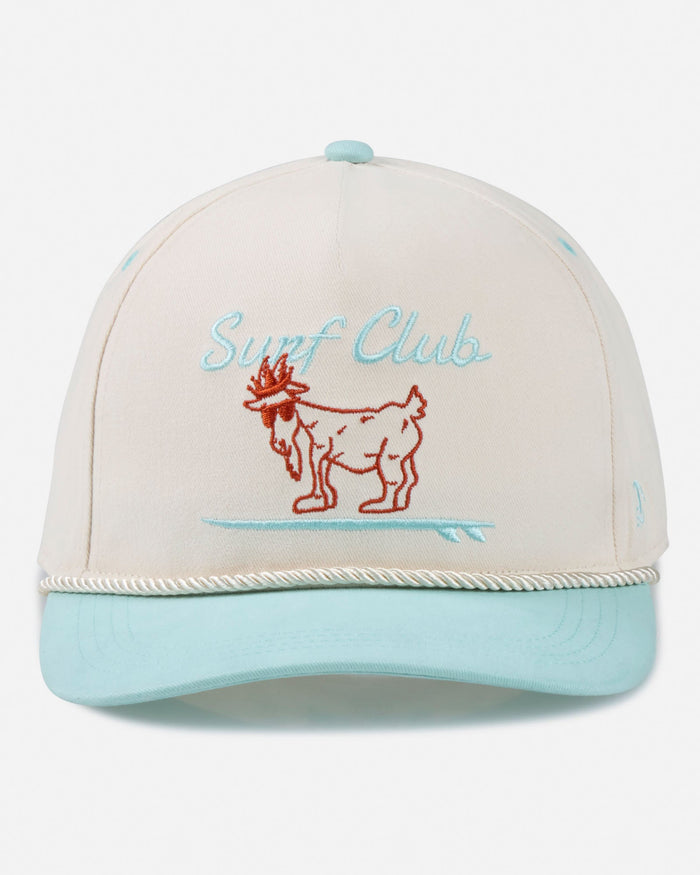 Beige and light blue cap with 'Surf Club' and goat illustration on a white background