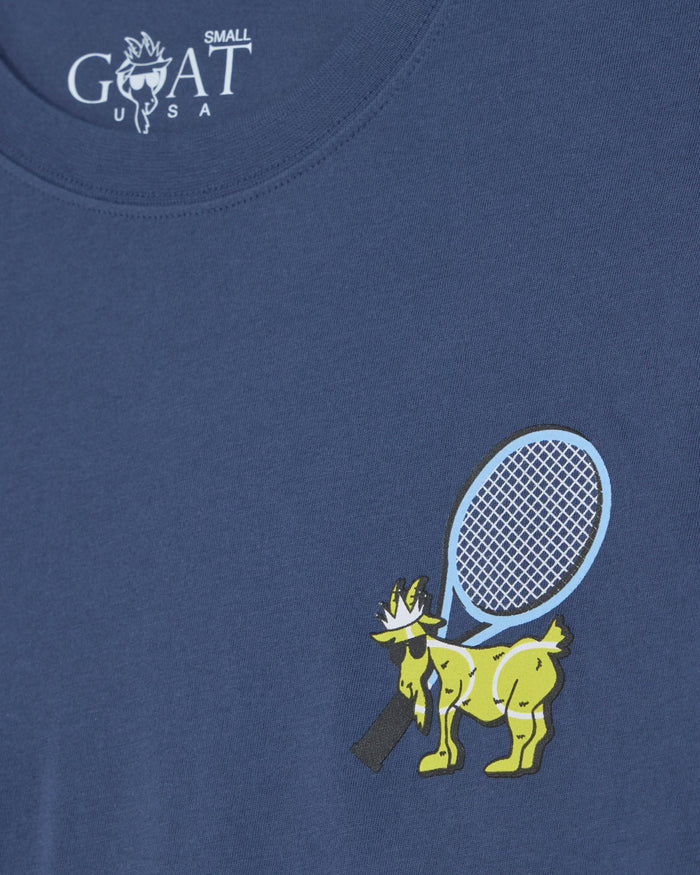Blue t-shirt with a graphic of a goat holding a tennis racket on a blue background