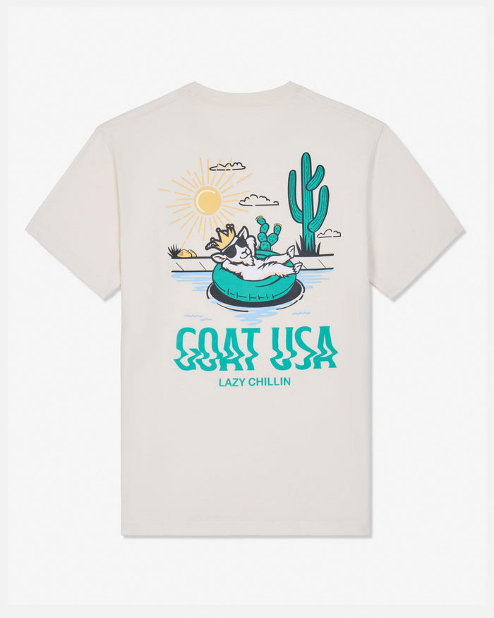 Beige t-shirt with a graphic of a goat in a pool and cactus, with 'GOAT USA' text on a white background.