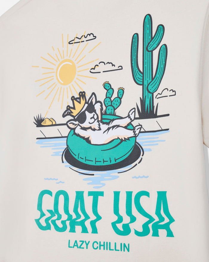 T-shirt with a graphic of a goat in a tube surrounded by cacti and a sun, with 'GOAT USA Lazy Chillin' text.