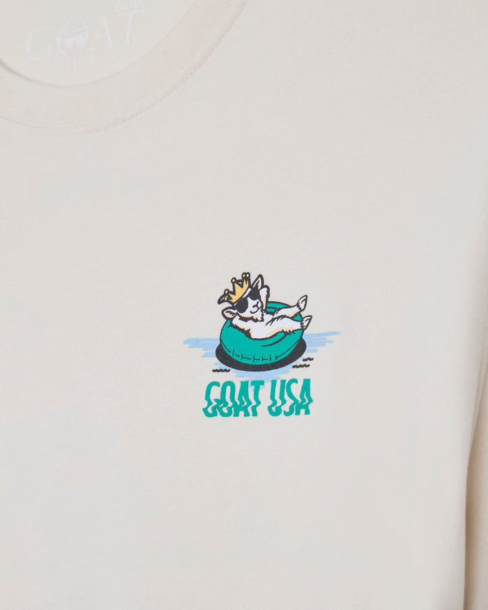 Beige t-shirt with a graphic of a goat in a pool and 'GOAT USA' text.
