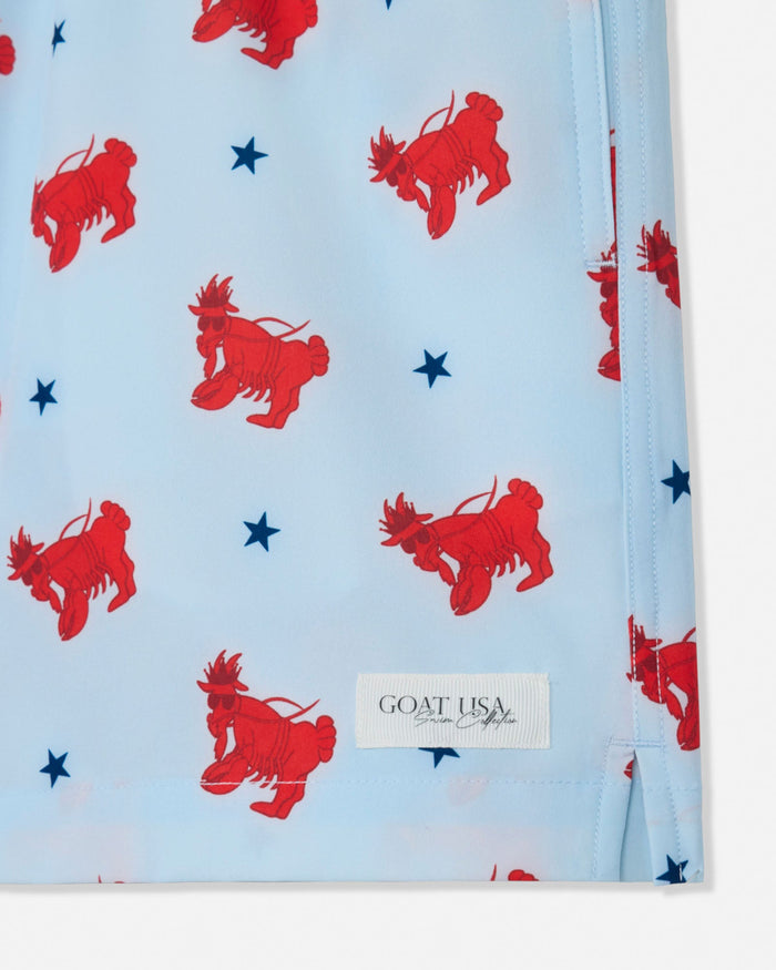 Light blue bathing suit with red lobster goat prints and blue stars, featuring the 'Goat USA' brand.