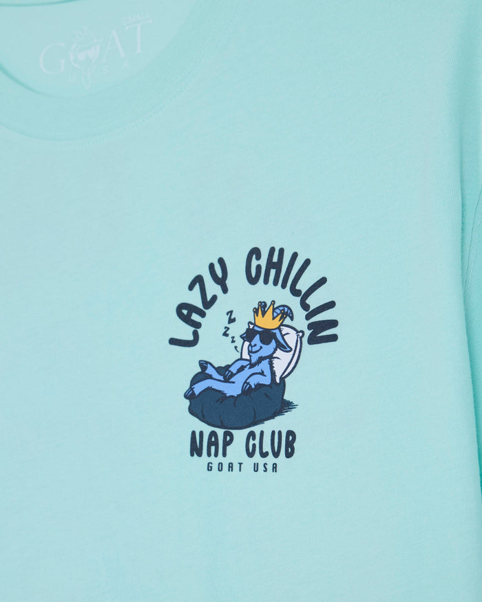 Mint t-shirt with goat laying in bed left-chest graphic