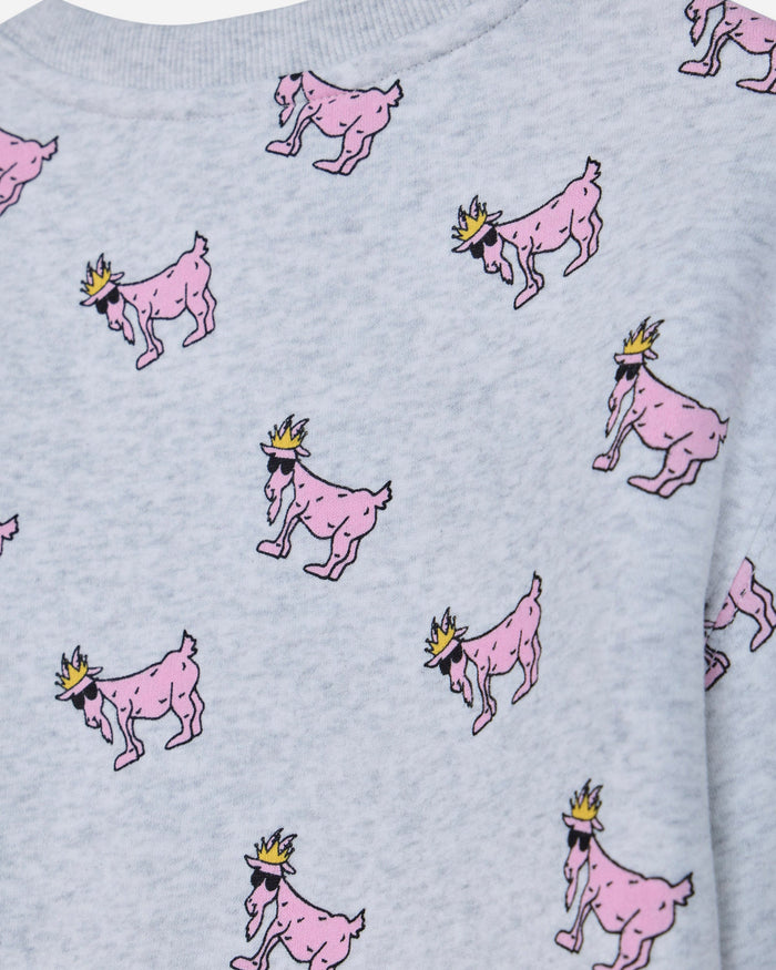 Close-up of a light gray heather sweatshirt featuring an all-over print of pink cartoon goats wearing small gold crowns.#color_pale-gray-heather