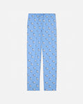Blue pajama pants with animal pattern on a light gray background