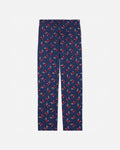 Navy blue pajama pants with red and white pattern on a light gray background